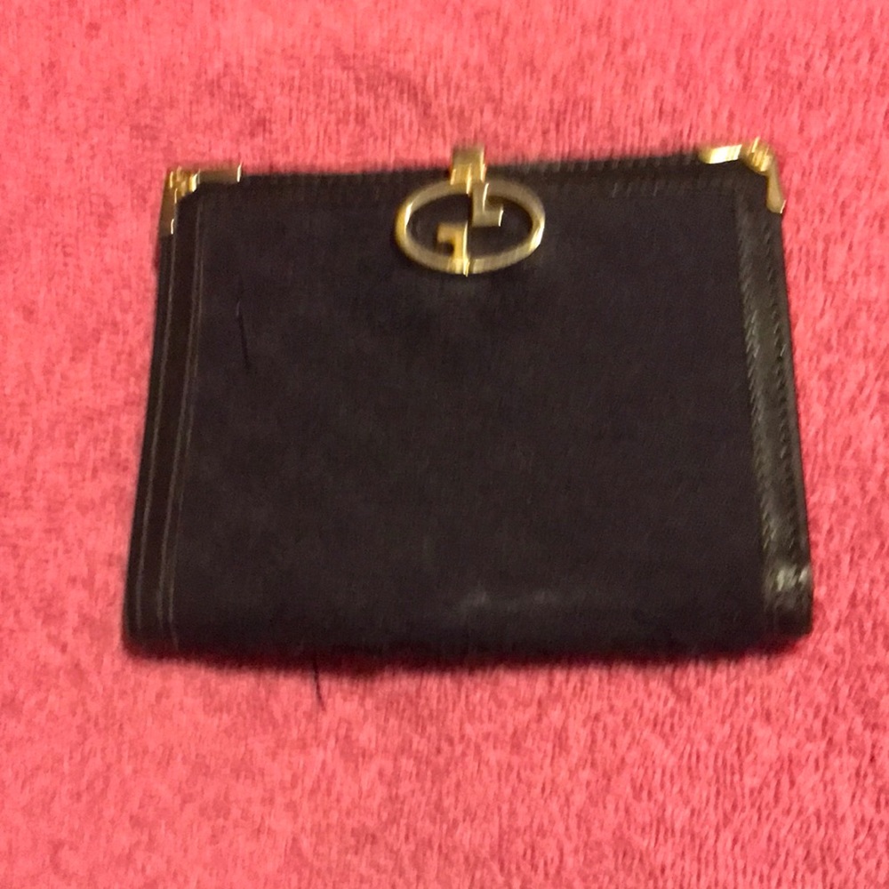 Black thin Gucci wallet for women or men.